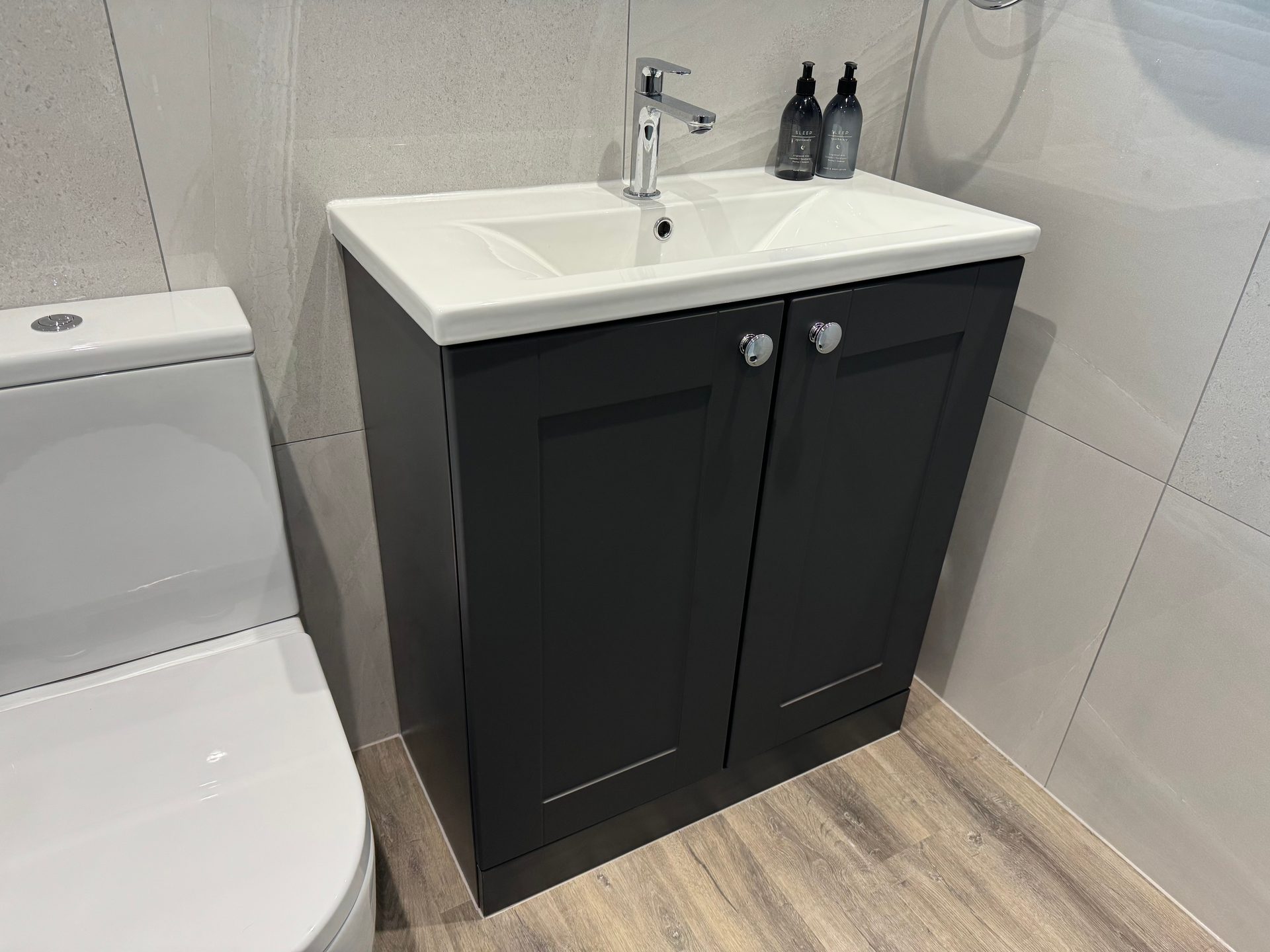 Black shaker vanity unit with a ceramic basin