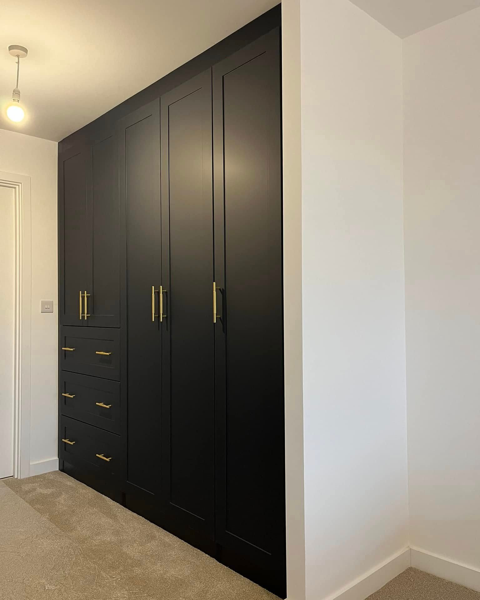 Black shaker wardrobe run with built-in drawers