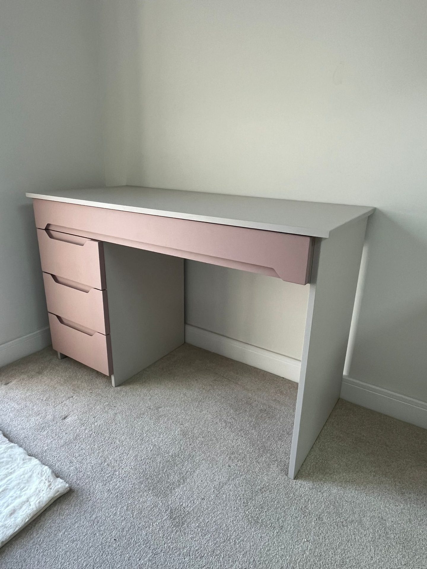 Grey desk with pink drawer fronts