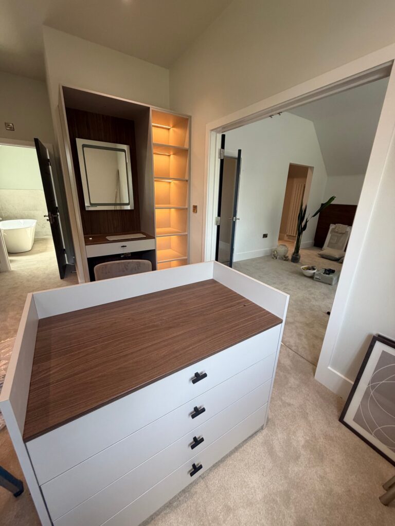 Dressing room island with four drawers and a wood-grain top