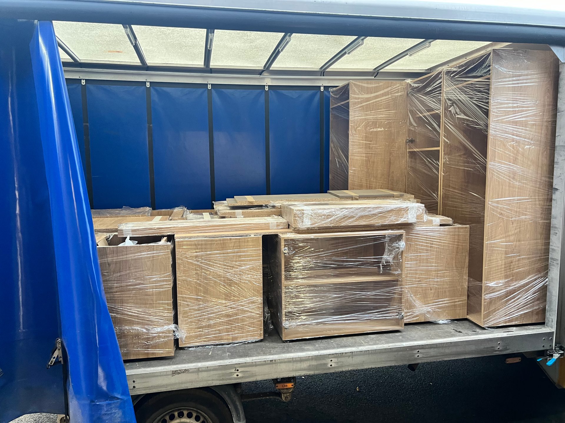 Wrapped kitchen carcasses loaded on a lorry for delivery