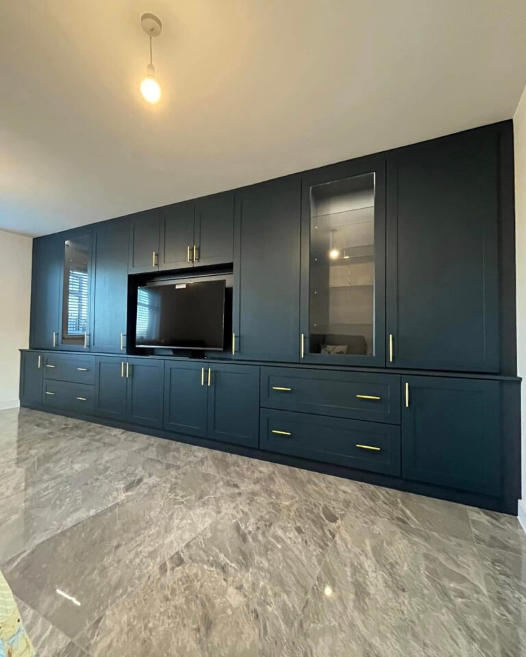 A navy shaker media wall