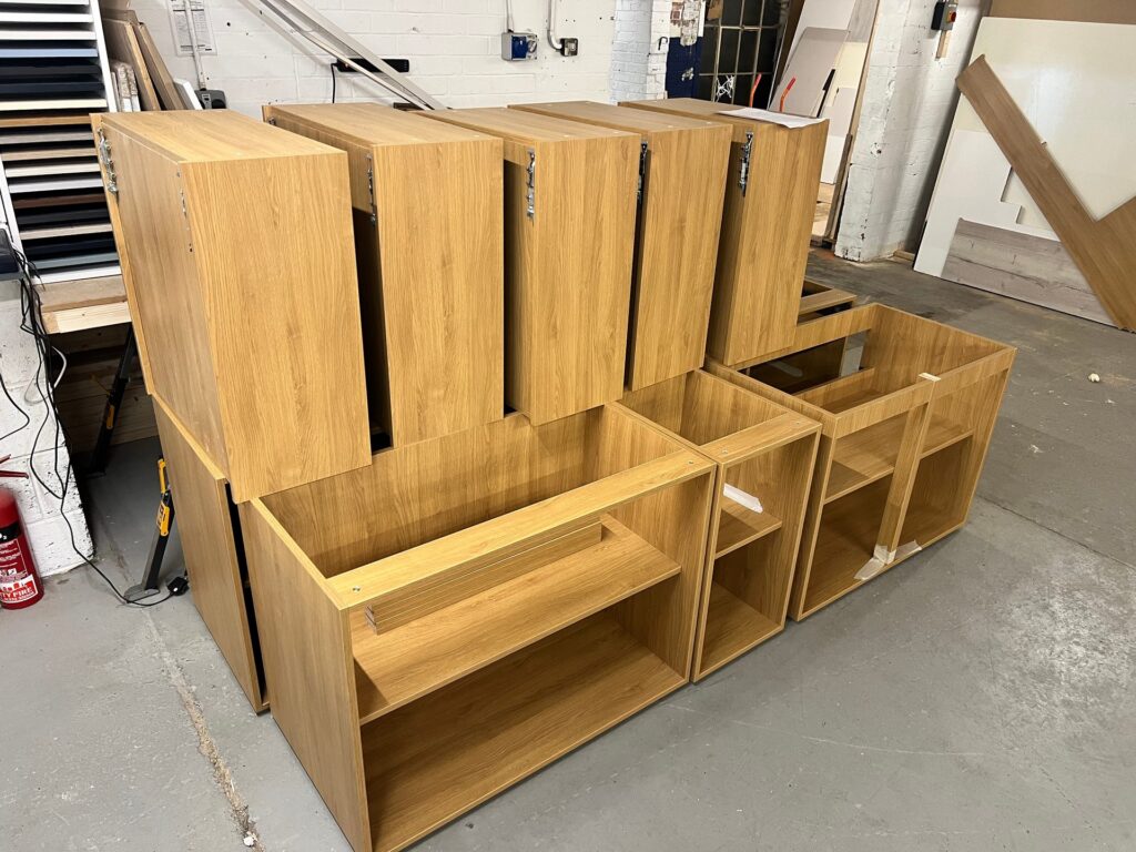 Assembled oak-effect kitchen carcasses in the DTJ Interiors workshop