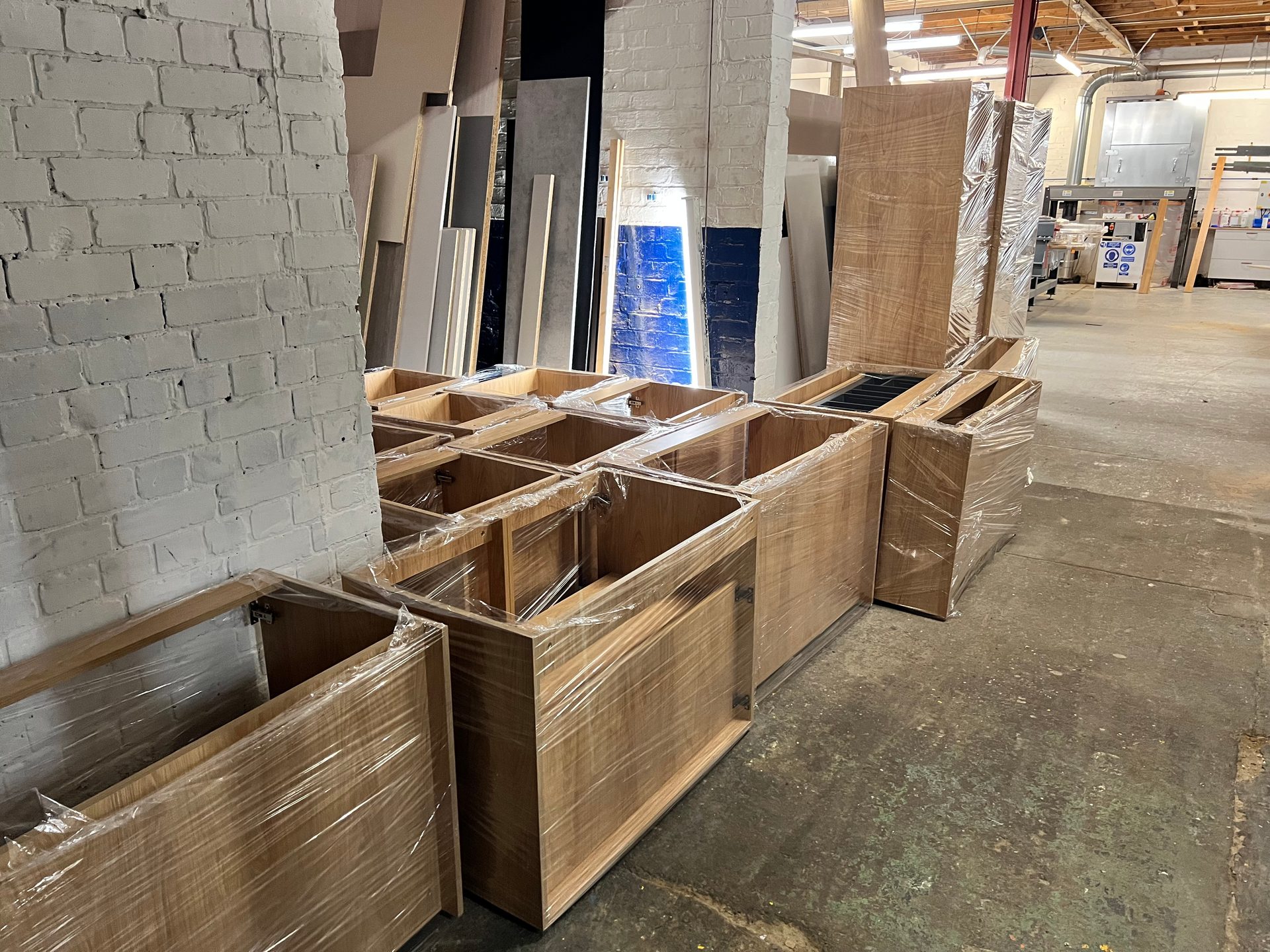 Oak-effect kitchen carcasses wrapped for delivery