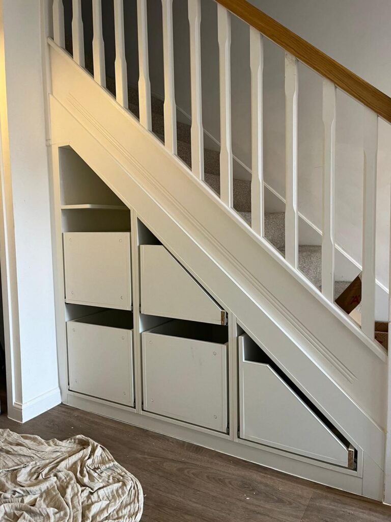 Pull-out drawers built under a staircase