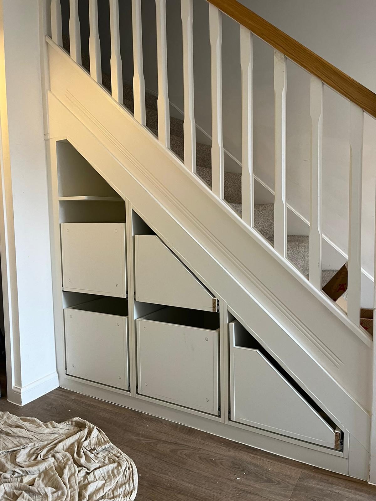 Pull-out drawers built under a staircase