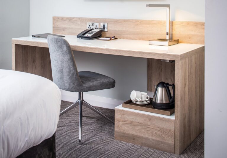 Desk between wardrobe returns