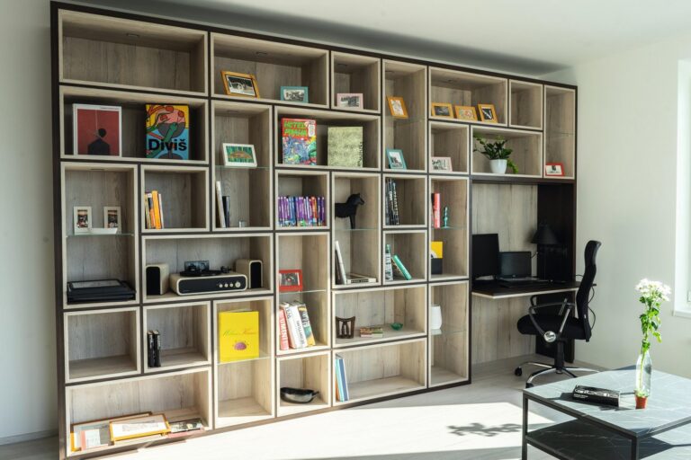 Open shelving wall with a desk return