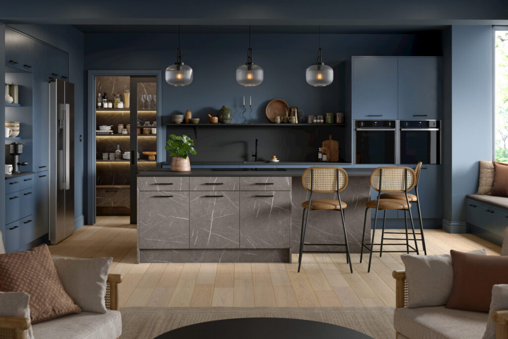 Kitchen island with grey marble-effect slab doors and blue matt tall units